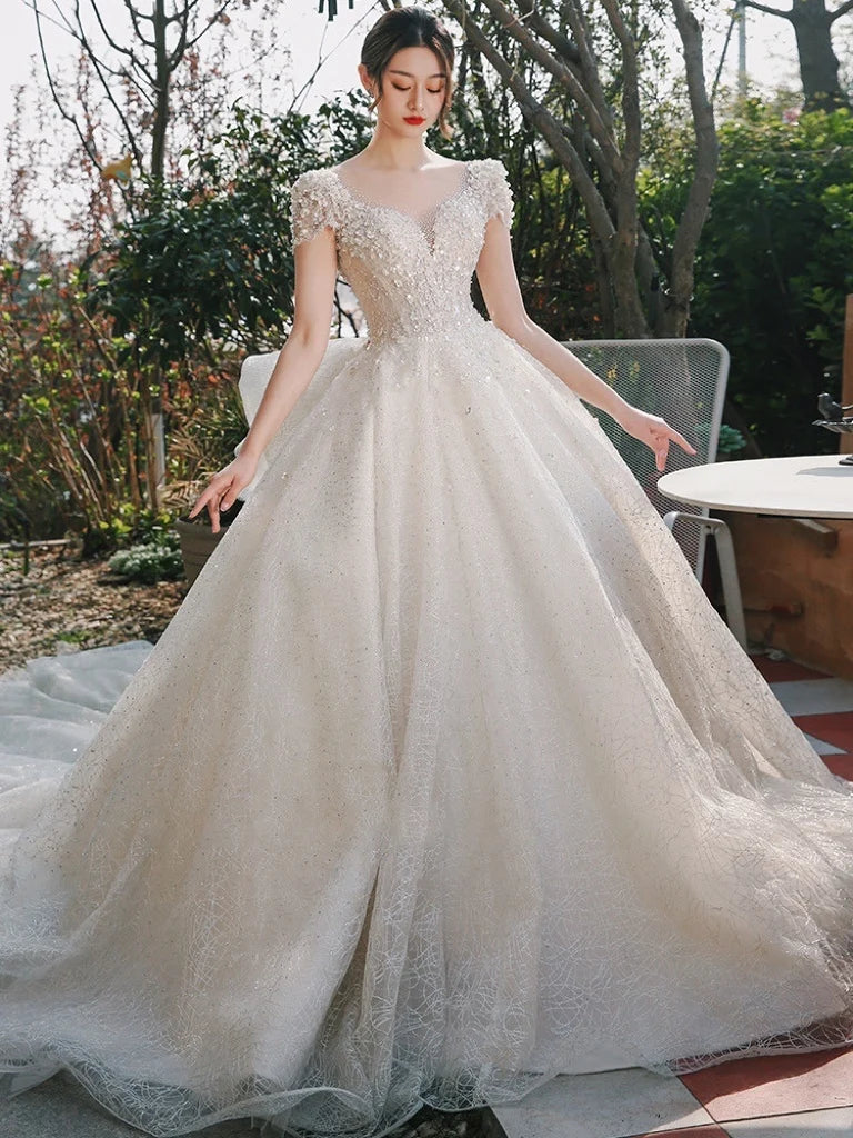 Elegant Off-shoulder Beaded Bridal Gown With Sleeves