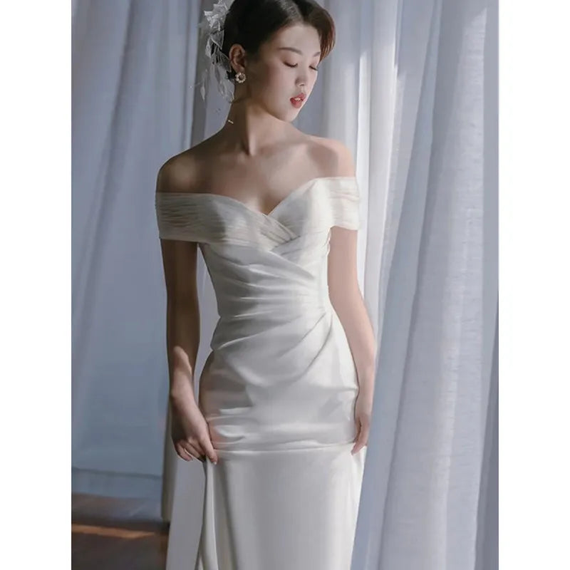 Luxurious Off-Shoulder Beaded Mermaid Evening Gown with Floor-Length Train