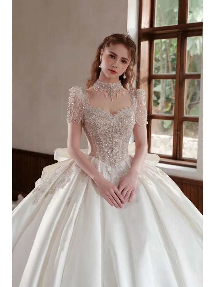 Elegant Beaded Bodice Bridal Gown With Sheer Sleeves