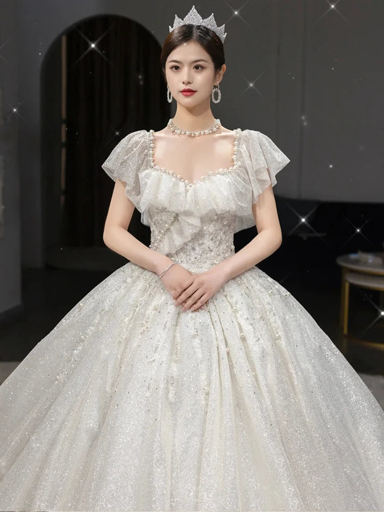Luxurious Pearl-embellished Layered Bridal Gown