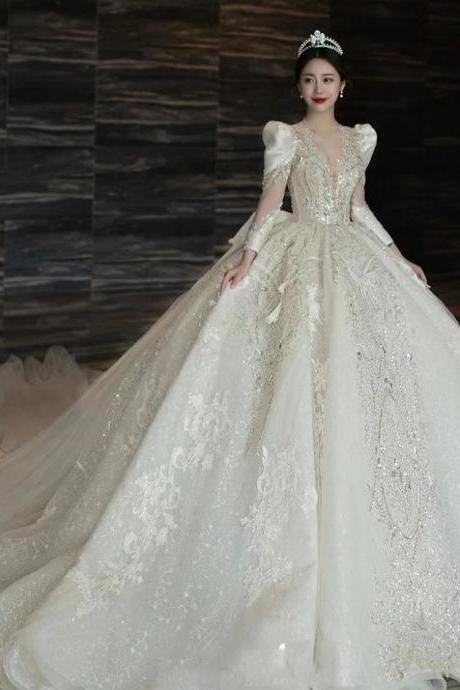 Elegant Bridal Gown With Lace Appliques And Beading
