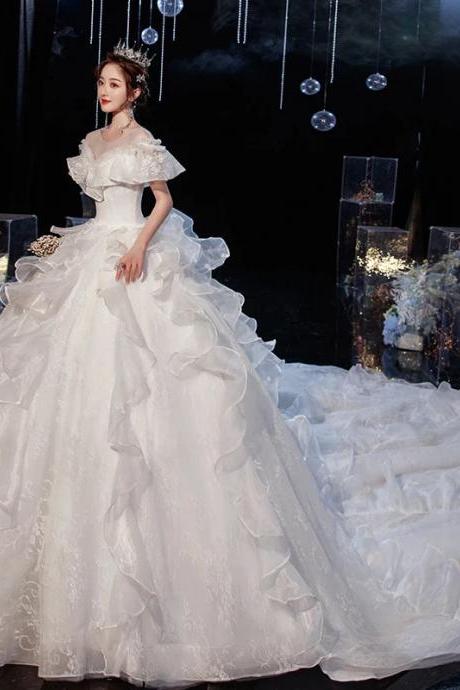 Elegant Off-shoulder Bridal Gown With Ruffled Skirt