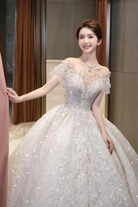 Elegant Off-shoulder Bridal Gown With Sparkling Embellishments