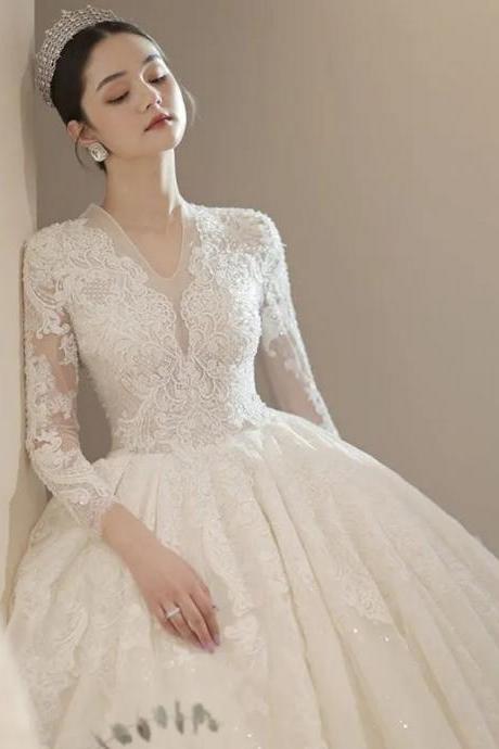 Elegant Long Sleeve Lace Bridal Gown With Tiara