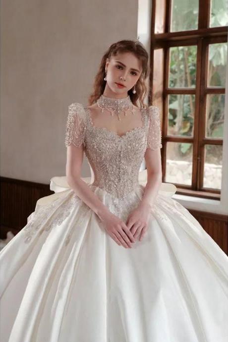 Elegant Beaded Bodice Bridal Gown With Sheer Sleeves