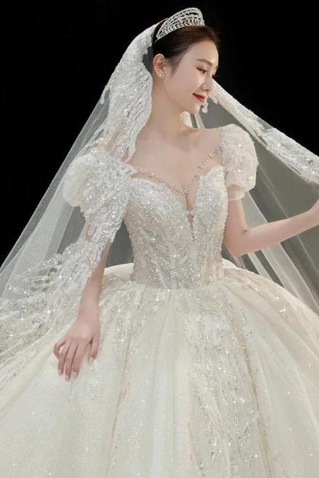 Elegant Beaded Wedding Dress With Long Sleeves And Veil