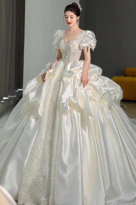 Elegant Satin Bridal Gown With Sheer Sleeves And Train