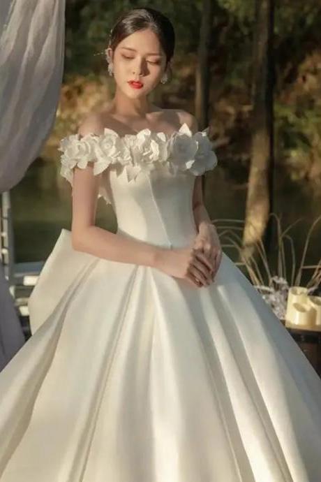 Elegant Off-shoulder Bridal Gown With Floral Accents