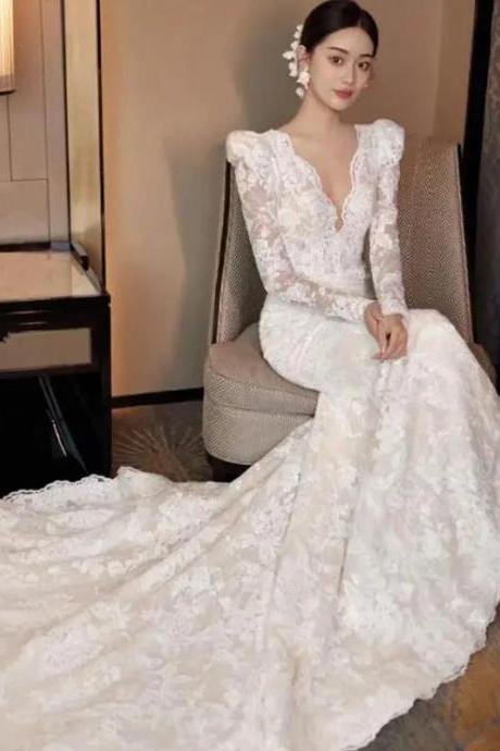 Elegant Long-Sleeve Lace Bridal Gown with Train