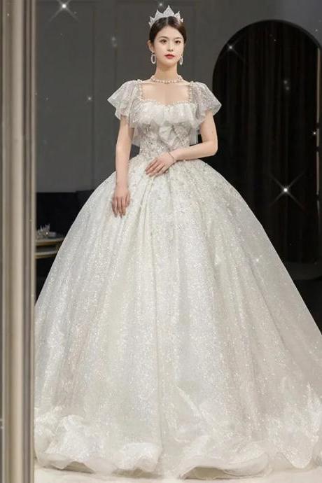Elegant Off-shoulder Glitter Bridal Ball Gown With Train