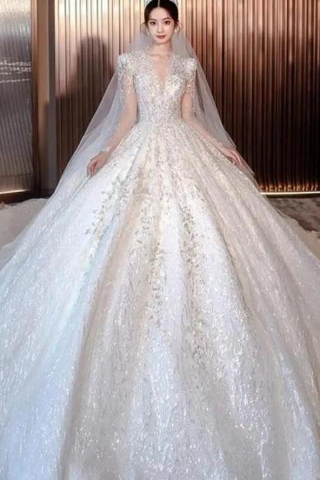 Luxurious Long-sleeve Sequin Bridal Gown With Train