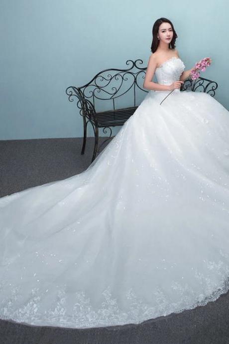 Elegant Strapless Bridal Gown With Lace Embellishments