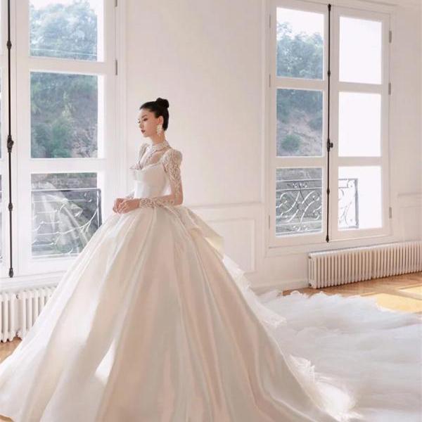 Elegant White Long-Sleeve Ball Gown Wedding Dress