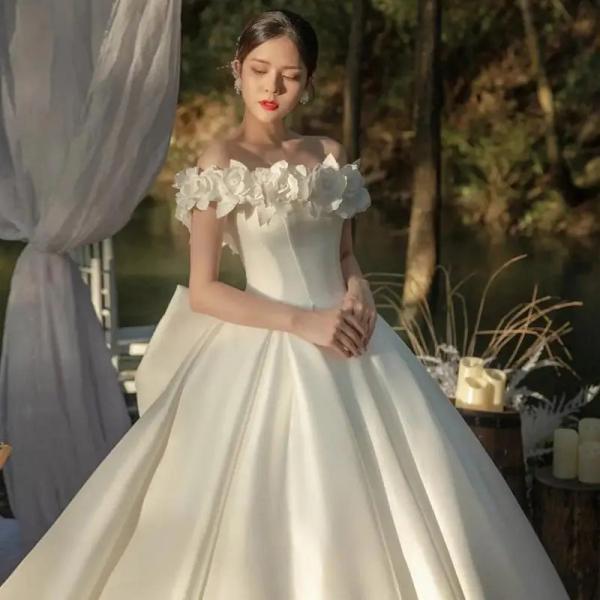 Elegant Off-Shoulder Bridal Gown with Floral Accents