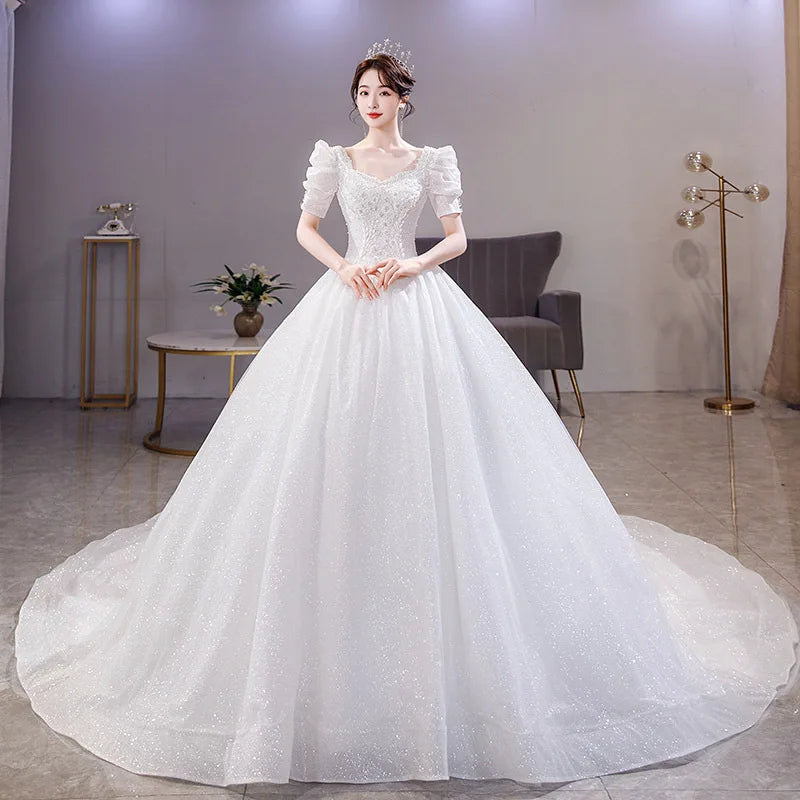 Puffy Sleeves Satin Wedding Ball Gown With Sheer Neckline main image 1